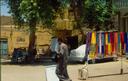Street scene in Luxor -- colorful blanket for sale.